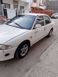 بروتون 2002 اللون ابيض اوتوماتيك رقم بغداد اللماني حرة بأسمي مكينة بدا...