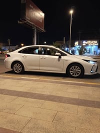 كورلا هايبرد 2025مكفوله رقم بغداد بسمي 07828221606