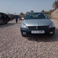 للبيع لانسر ٢٠١١ الشركة العامة رقمها بغداد سنوية مجددة لل٣٠ بأسمي للاس...