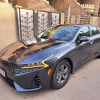 K5 lxs  رصاصي غامق شذرة  موديل ٢٠٢٣  رقم بغداد بأسمي  وارد امريكي ضربة...