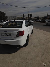 كيا ريوم  موديل 2011  بيها شبر بل بوند وباب النفر بارد   07770122420