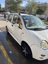 كيوكيو 2013 السياره مكفوله كير ومكينه تبريد شغال  رقم بغداد سعرها 33 ل...