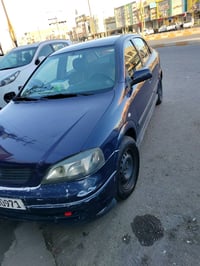 وبركاته  للبيع اوبل استرا 2002  انكليزي وبسمي كير ومحرك مكفول تخم تاير...