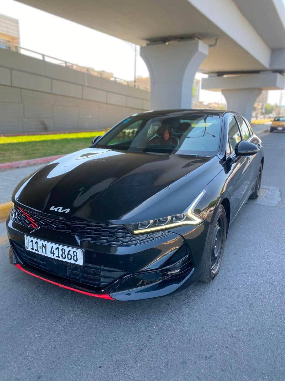 السلام عليكم عندي كي فايف للبيع 2023 KIA K5, GT-LINE فوول مواصفات 1/1 وارد امريكي حادثها بنيد فقط وبيها تعديل براس الشاصي سيارة جديدة ماشية 50 الف كيلو رقم بغداد بأسمي تحويل مباشر 
1-بانوراما 
2-بصمة 
3-شاشة جبيرة 
4-كامرة دوارة 
5-اشاير بالمري 
6-داخل احمر 
7-كشنات جلد 
8-كشنات كهرباء 
9-اوتو هولد 
10-تبريد منفصل 
11-هند بريك بصمة 
12-رادار امامي 
13-رادارات جانبية 
14-تحديد مسار 
15-قيادة ذاتية 
16-لايتات امامية زنون 
17-لدات امامية زنون 
18-بك لايت لد 
19-نظام كار بلي 
20-مكينة 1600 تيربو 
وبعد بيها مواصفات هواية مكان السيارة بغداد الطوبجي للاستفسار الاتصال *********** رايدها ب 138 وبيها مجال بغداد, العراق

