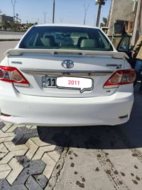 تيوتتا كورلا  خليجي2011 الشركه العامه ابيض بغداد بسمي رقم وسنويه مانقه...