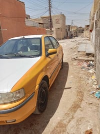 عندي سيارة سمند 20012 المكان بغداد مدينة الصدر اريد ابيعها محتاج واليا...