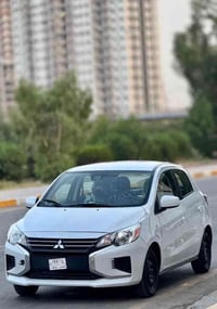 للبيع.   مسيوبيشي ميراج  رقم بغداد بسمي     موديل 2024  🔴لون سلفر قريب...