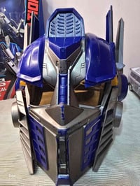 قناع أوبتيموس برايم • أصوات الشخصية • توصيل العراق