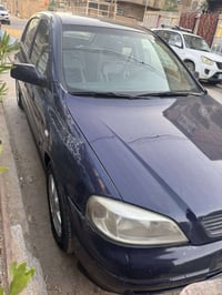استرا ٢٠٠٢ رقم بغداد جاملغ خلفي صبغ فقط تبريد شغال صدر نضيف كير ومكينه...