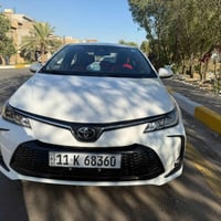 كورلا هايبرد 2025 داخل احمر كرسي كهرباء فول مواصفات ماشيه 24km كفالة ع...