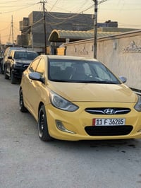 اكسنت 2014 وارد امريكي رقم بغداد انكليزي ظربتهة بل جنطه الخلفيه ومرجعه...