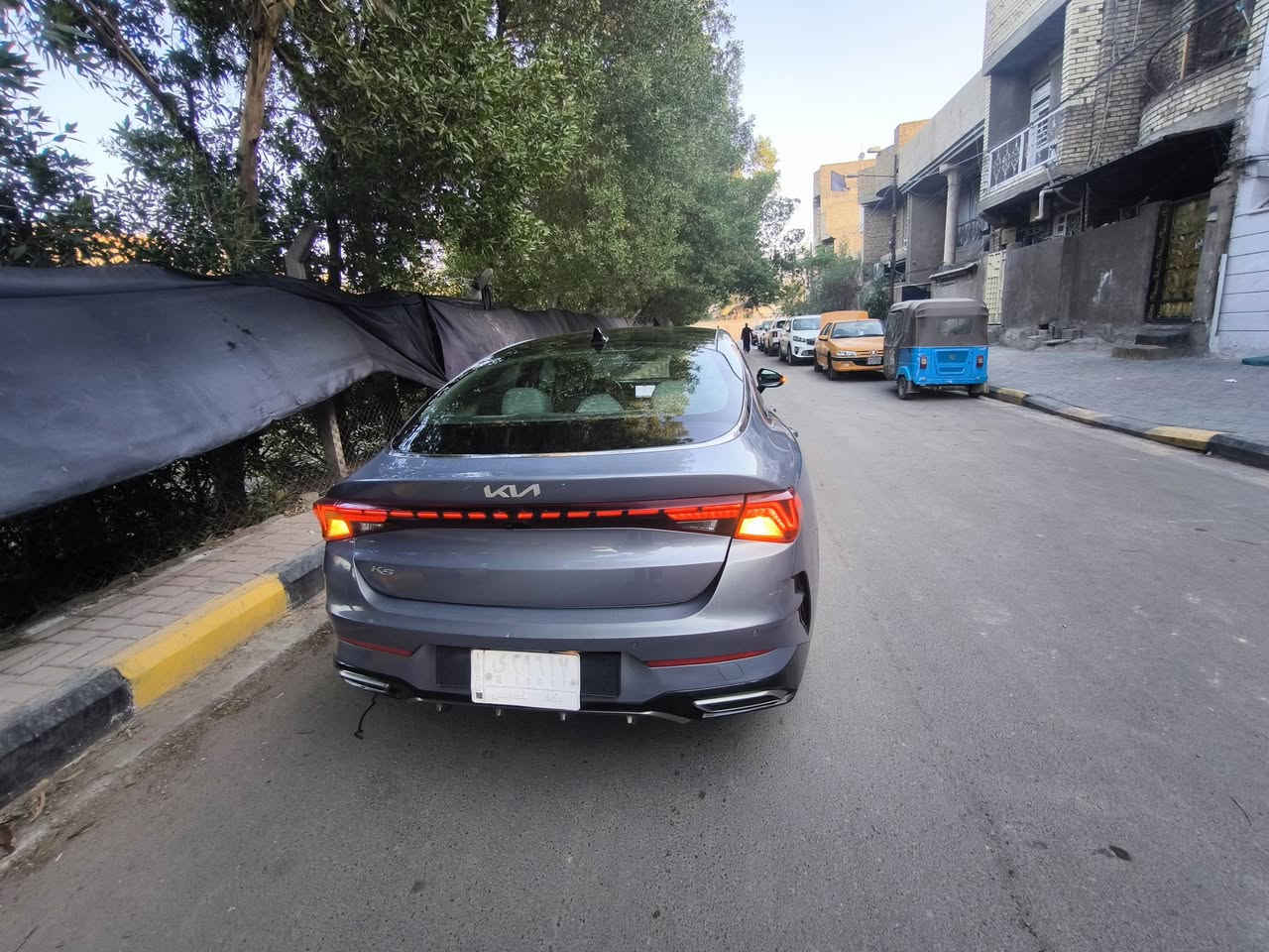 كيا 2022 K5 EX لون معدني فول مواصفات واحد على واحد اعلى فئة
 باقيلهة سنتين ونص وتصير حرة
السياره حادثهة فقط الجمالغ الخلفي جهة السائق .. ((حادث امريكا)) بدون شواصي بدون ايرباك كفالة
وبارد بسيط ((بالعراق)) نص شبر بالجاملغ الخلفي   
بدون ايرباك . 
بجم كبس 
ماشية67مايل
(منظومة غاز اضافة) قبل سنة  شديتهة ام الضمان (الدورة)
المواصفات EX فول 1/1. 
1- بصمة ابواب + تشغيل عن بعد. 
2- شاشة حجم كبير + داخل صاج ملكي. 
3- رادار امامي وجانبي وخلفي و بريك طوارئ وحساسات خلفيه. 
4- هاندبريك بصمة +ميموري كشن + تبريد وتدفئه كشنات وتدفئه استيرن + كشنات الاماميه كهرباااء.+شحن واير ليس. 
5- صندوق ذكي يفتح عند الاقتراب
6- بك لايت لد كامل. 
7- ويل كب  18
8- تبريد شاشة منفصل+ قطعتين تبريد. 
10- سياقة الكترونية + تحديد مسار.  
12-  نظام الترحيب الصوتي + الشاشات. 
13-  اناره داخليه لمس. 
14- تبريد شاشة منفصل. 
15- 4 وضعيات قيادة بل ماوس  
16-اوتو هولد للتوقف الالكتروني بل ازدحام. 
17- محرك 1600 turbo 🚀🔥
18-كامرة 360 درجة يعني خمس كامرات
كفالة كير محرك صدر تايرات سيارة جديدة مال جناي .
--معوقين بغداد--
ضمان الوكالة العامة والتحويل.. السيارة بيهة قسام شرعي كامل+ وكالة عامة
170 بيهة مجال بسيط  
مكاني 🌎 بغداد / م الصدر 
***********
