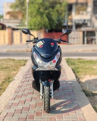 دراجة PCX ياباني السعر1450 المكان بغداد الشعله رقم الهاتف. 07727294560