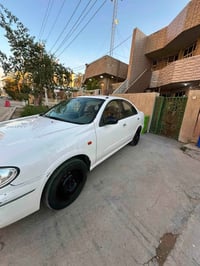 نيسان سني ياباني 2009رقم بغداد الجديد صبغ قبغ جنطة +ربع جاملغ ، مكينة ...
