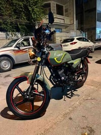 حبايب دراجه ماكس وان  لون زيتوني الدراجه خير من الله كلش نضيفه مكينه م...