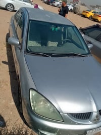 لانسر 2008 بغداد بسمي  قبل 3 سنوات صار بيها حادث بجم اشرته بالصورة  وع...