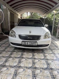 اوبتما 2009  خليجي  سيارة كلش نظيفة  دينار ما تصرف عليها  تبريد ثلج  ت...