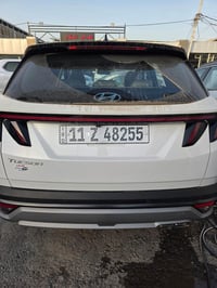 توسان 2025 زيرو مرقم بغداد لوحة وسنويه  الموصفات قماره ابيض  كشنات تبر...