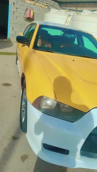 شارجر للبيع موديل 2011 جاهزه للعمل مابيهه نقص للاستفسار 07732107023