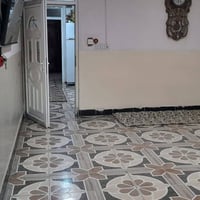 بيت للبيع حي الوحده المساحة100رقم 07752149314