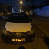 نيسان فيرسا موديل 2010 ضربته جاملغ وباب خلفي كير مكينه كهربائيات صدر ك...