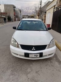 لانسر ٢٠٠٧ • اوتوماتيك • تاير جديد