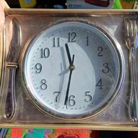 ساعة جداري • ٢٥×٣٠ سم • بابل الكفل