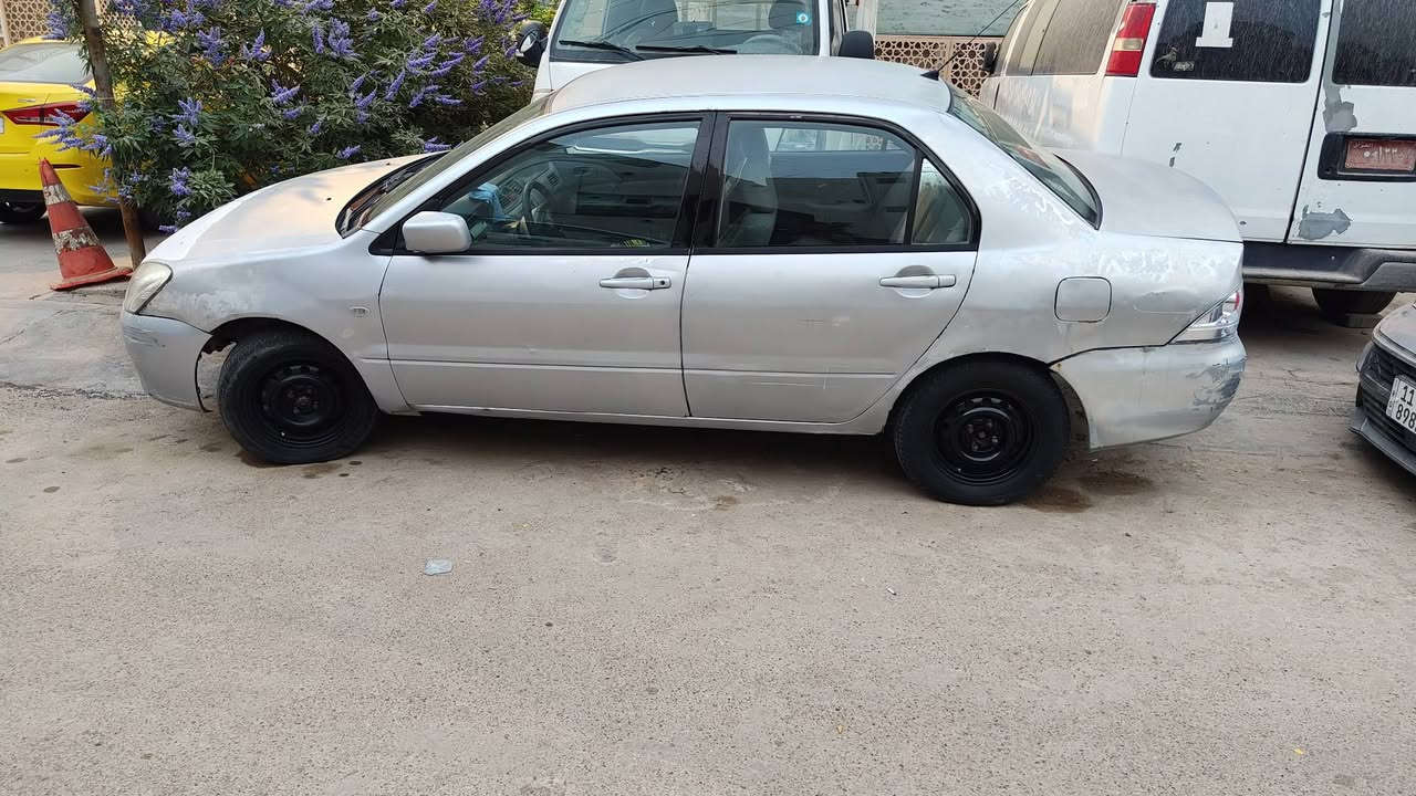 لانسر بومة موديل 2004  الشركة العامة للسيارات  كير عادي رقم بغداد انكليزي   هزة وسنوية جديدة الى 2031  تبريد شغال  صدر نظيف تايرات نظيفة والكشر شوف العين  مكان السيارة بغداد السعر 53. للاستفسار الاتصال على ***********      *********** ابوريحانة
