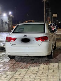 كيا أوبتيما 2009  فول مواصفات فتحه بل قماره  تحكم بل ستيرن بيه ربع بني...