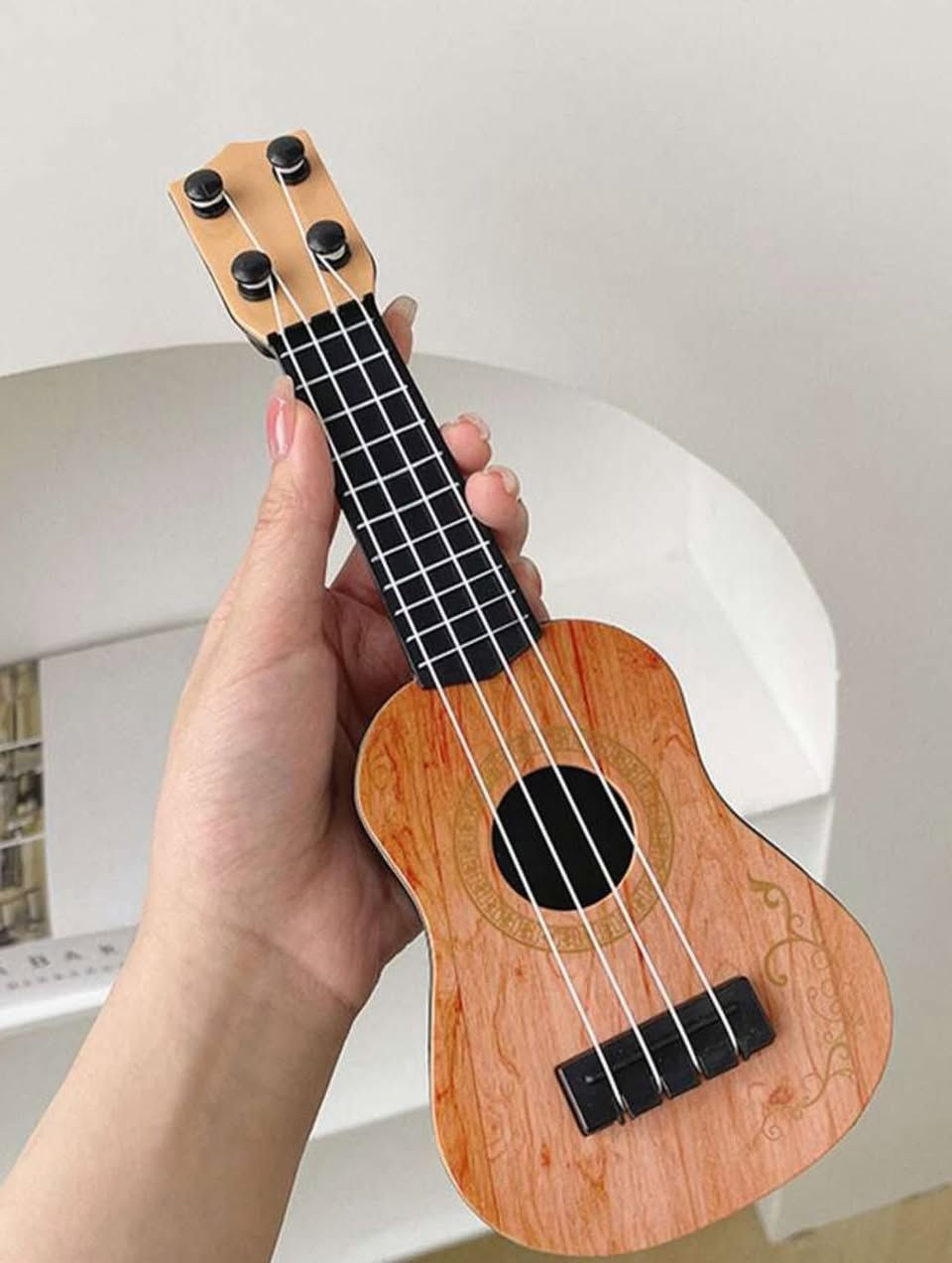✨ غيتار ديكوري صغير – لمسة فنية بأي مكان ✨
تحب الديكور المختلف؟
هذا الغيتار الصغير يضيف جو موسيقي أنيق لغرفتك 🎶

🔹 حجمه صغير وخفيف
🔹 مثالي للديكور: غرف النوم، المكاتب، الرفوف
🔹 تصميم خشبي جميل يلفت النظر
🔹 هدية حلوة لعشّاق الموسيقى 🎁

💰 السعر: 8,000 دينار مع التوصيل لجميع المحافظات 
🚚 التوصيل متوفر لكل المحافظات
#إكسبلور #العراق #امزون


**إذا كنت صاحب هذا الإعلان وتريد حذفه لأي سبب، رجاءا أرسل رسالة إلى الدعم الفني**