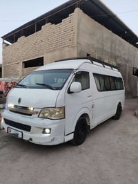باص جنبي • ١٤ راكب • تدفئة كهربائية