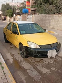 لانسر 2010 بغداد انكليزي بيه طخه بالجاملغ الامام السائق والهلالات صبغ ...