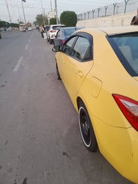 كورولا وراد أمريكي مديل 219 مصفره من هيه وغرمات السياره حادث تبديل بني...