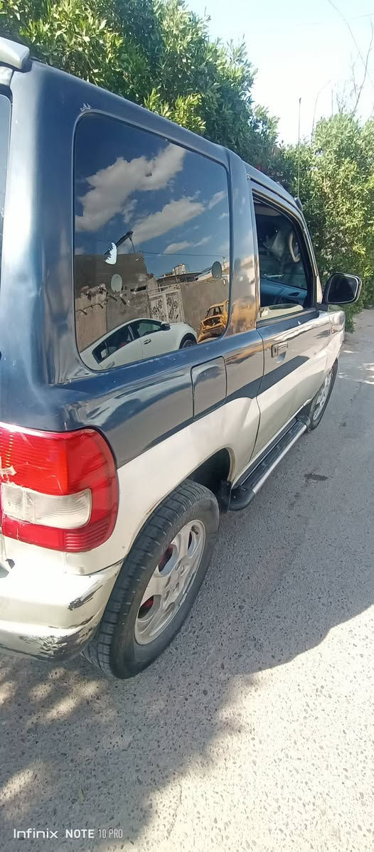 باجيرو ربع موديل ٢٠٠٠ رقم واسط دولي هزه جديد مكان السياره في بغداد محرك ونجي ٤سلندر السعر ٤٠  استفسار هاتف ***********/***********
