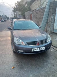 لانسر وارد امريكي 2007 محرك 2000 السعر 68 وبيها مجال مكانها بغداد الجد...