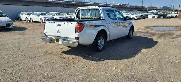 مسيوبيشي موديل 2015  L200 لبيع رقم بغداد جديد سياره جاهزه السعره 130 $ ***********
