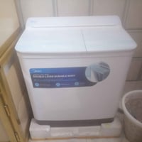 غسالة جديدة استخدام ١٤يوم البيع السعر 250قفل  رقم الهاتف 07750842554