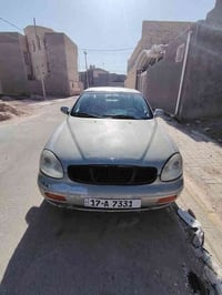 وبركاته دايو لكنزا مديل 2000 محرك جديد حاويه تبريد شغال  كير عادي نمره...