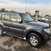 عند باجيرو موديل 2009خليجي رقم انكليزي بغداد بسمي 7راكب كير ومحرك وصدر...