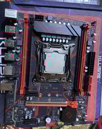 مذربورد Kllisre • معالج E5-2650v4 • كرت GT610