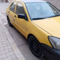 لانسر موديل ٢٠١٠ • مكينة جاهزة • بغداد زعفرانيه