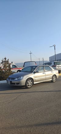 07721059205 لانسەر مۆدێل 2008 مەکینە گەورە   کامل بۆیاخە پێشی کەمێک لێ...