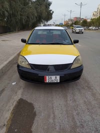 لانسر ٢٠١٠ • رقم قادسية • محرك وقير جديد