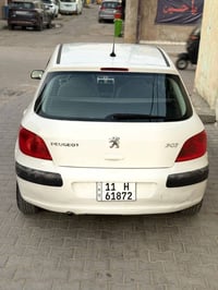 بيجو 307 رقم بغداد انكليزي هزة جديدة  موديل 2005 بأسمي تحويل مباشر الع...