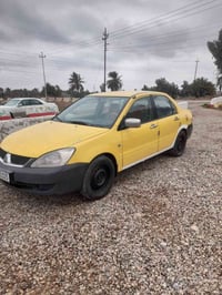 للبيع لانسر ٢٠٠٩ رقم ديالئ الجديد كير مكينه جديد السعر ٦٥وبيهه مجال ٠٧...