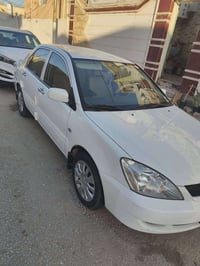 لانسر موديل 2006 سياره نظيفه مكفوله من كير ومحرك وكهربايات  سياره 75 و...