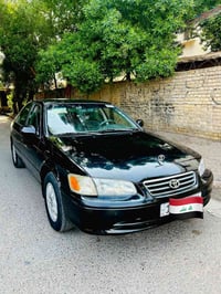 كامري 2001 لون اسود ، وارد امريكي ، رقم بغداد انكليزي بأسمي تحويل ثاني...