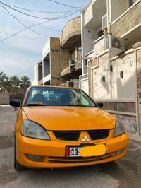 سياره لانسر 2008 للبيع المكينه 2000 وكير اوتماتيك او صدر او تبريد وكهر...