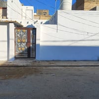 النجف حي الميلاد • ١٠٠م • واجهة ٨ ونص