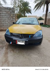 لانسر للبيع فقط موديل (2011) رقم بغداد  دولي  سنويه بأسمي لل30 شرط الت...